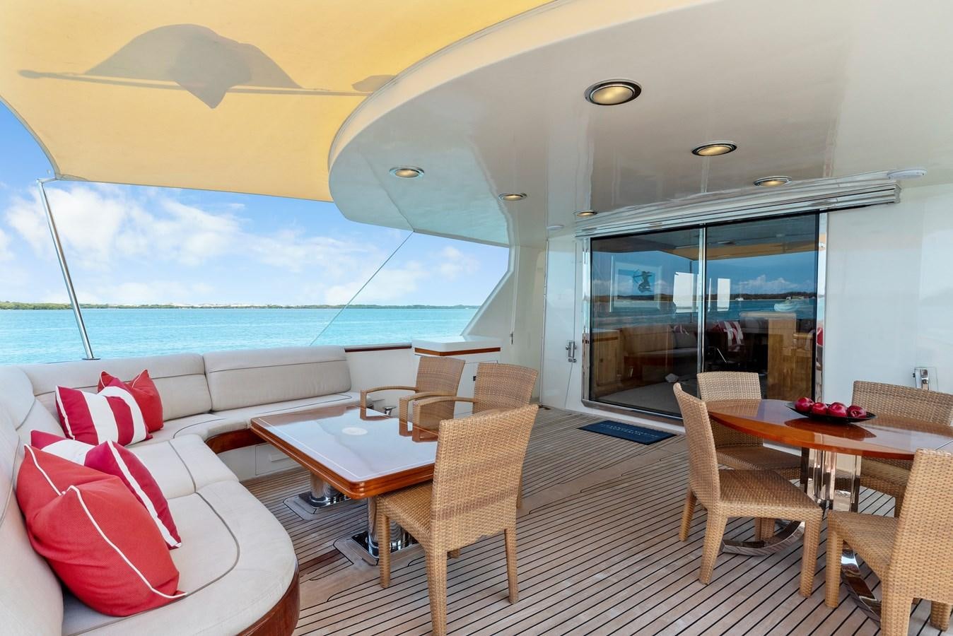 a room with a table chairs and a large window aboard HUNTRESS Yacht for Sale