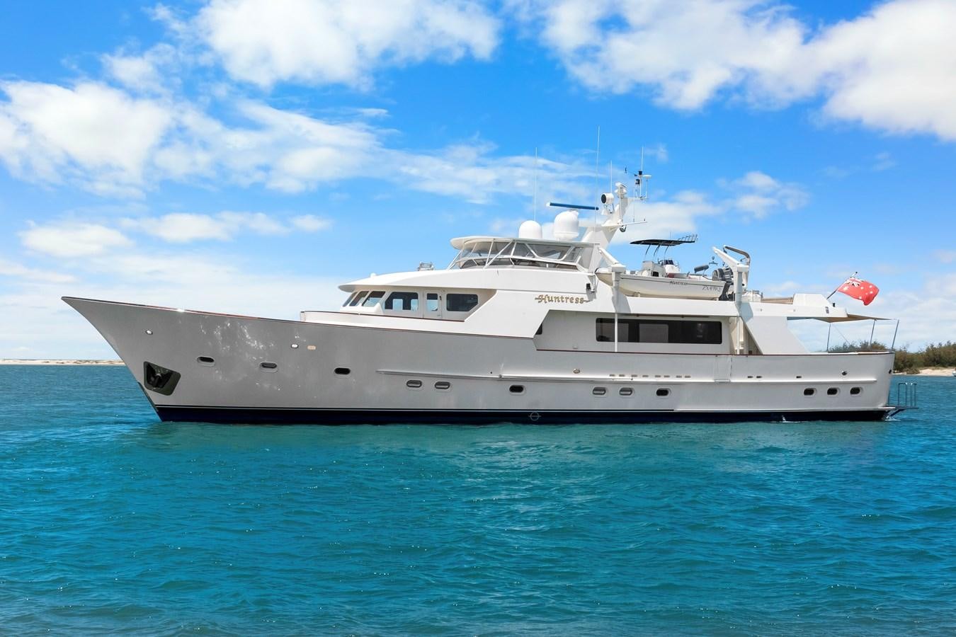 a white yacht on the water aboard HUNTRESS Yacht for Sale