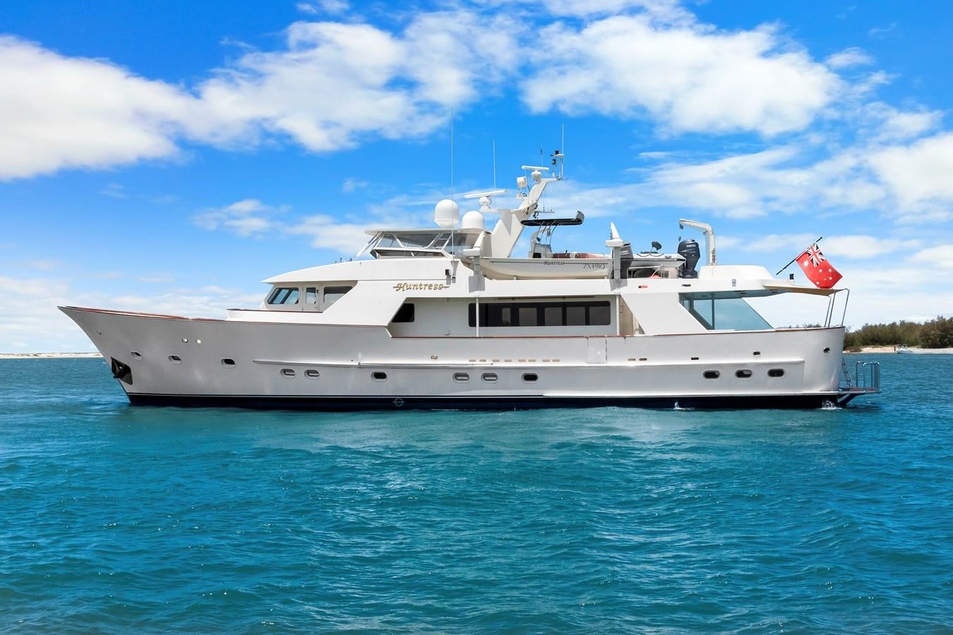 a white yacht in the water aboard HUNTRESS Yacht for Sale