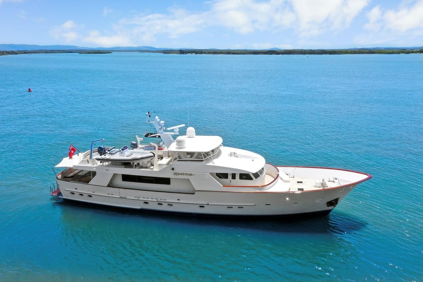 a white boat in the water aboard HUNTRESS Yacht for Sale