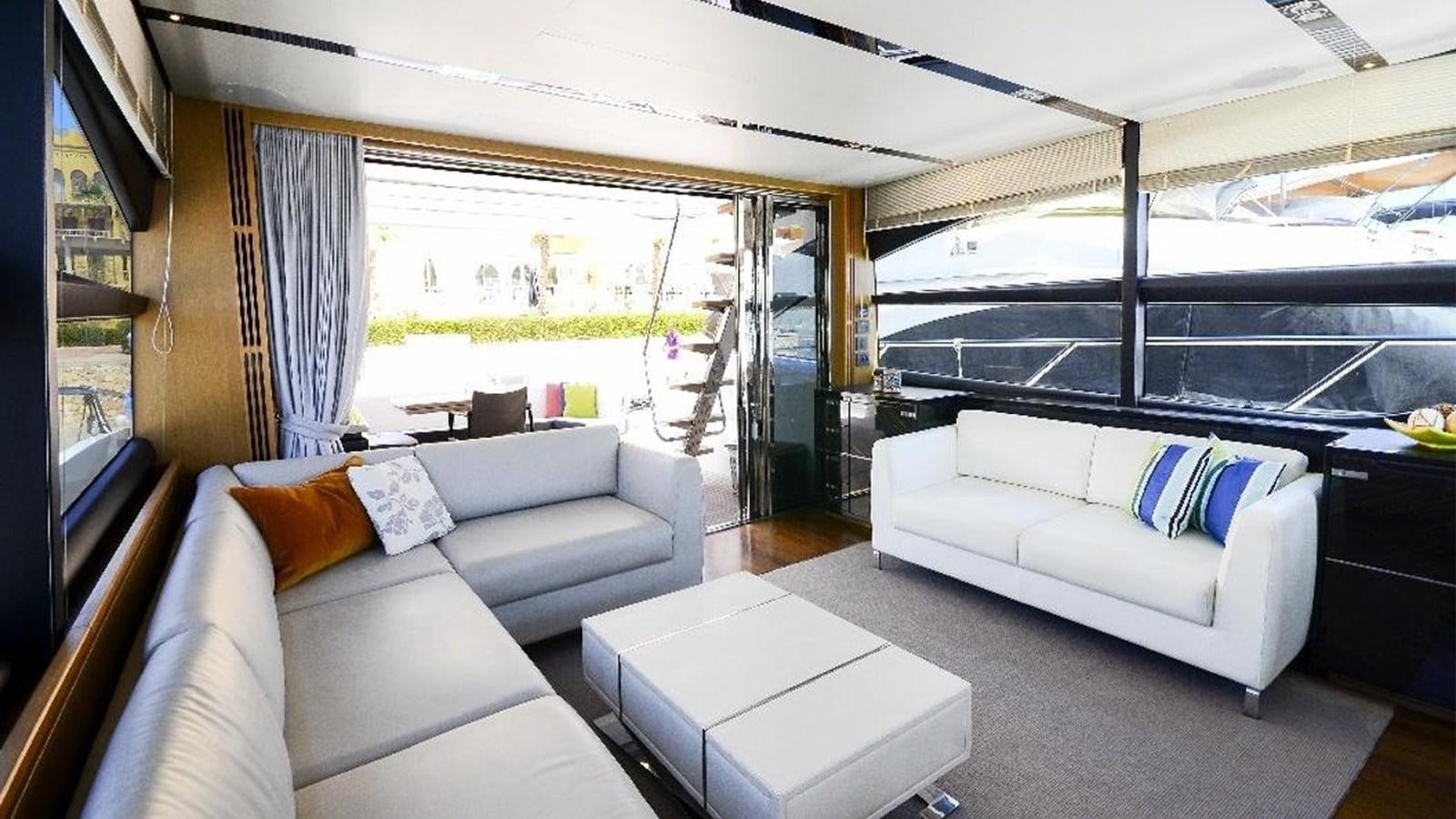 a living room with a large window aboard NAVY Yacht for Sale