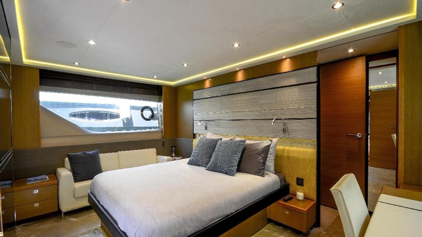a room with a bed and a window aboard NAVY Yacht for Sale