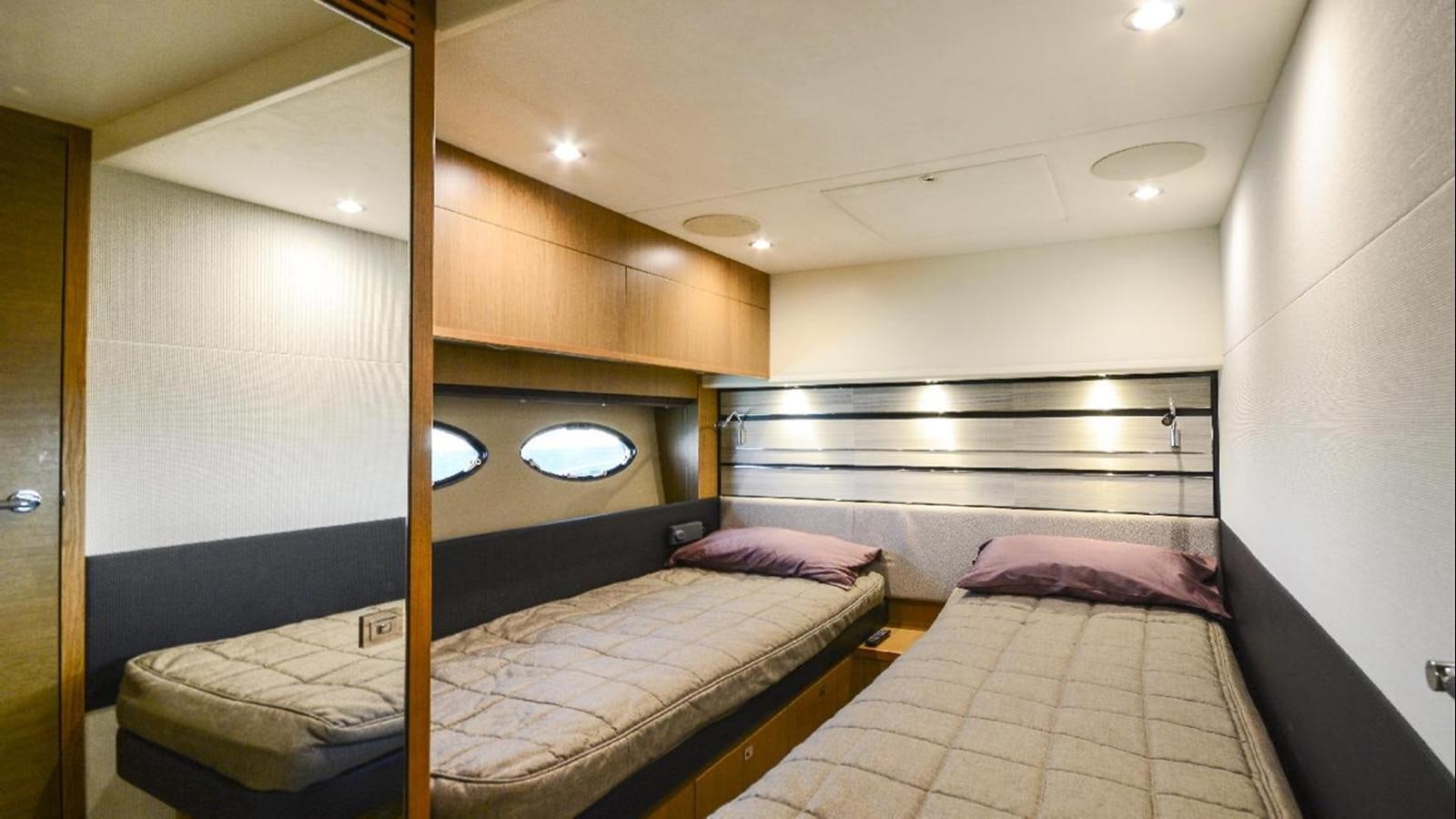 a couple of beds in a room aboard NAVY Yacht for Sale