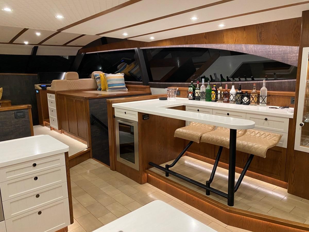 a kitchen with a bar and bar aboard THE KEYS Yacht for Sale