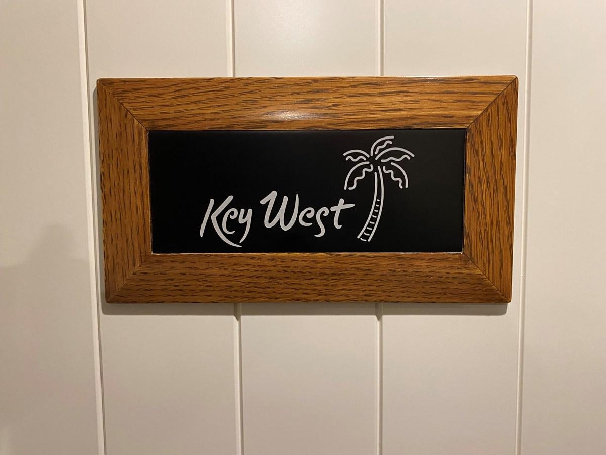 a sign on a door aboard THE KEYS Yacht for Sale