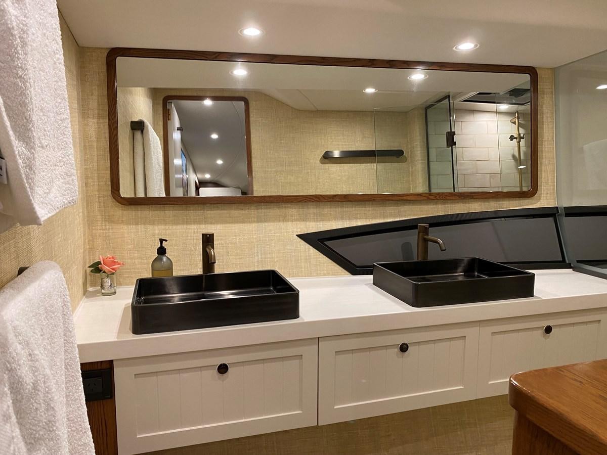 a bathroom with a large mirror aboard THE KEYS Yacht for Sale
