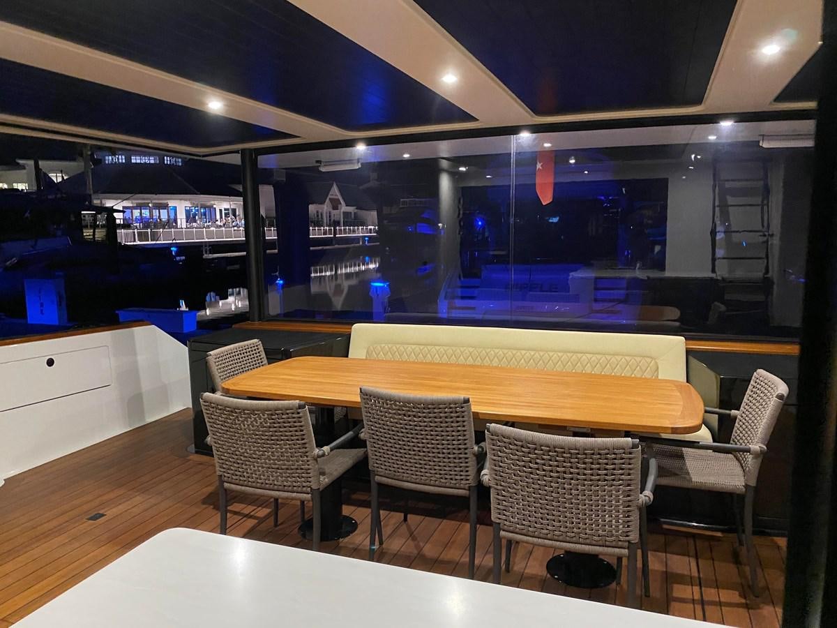 a room with tables and chairs aboard THE KEYS Yacht for Sale