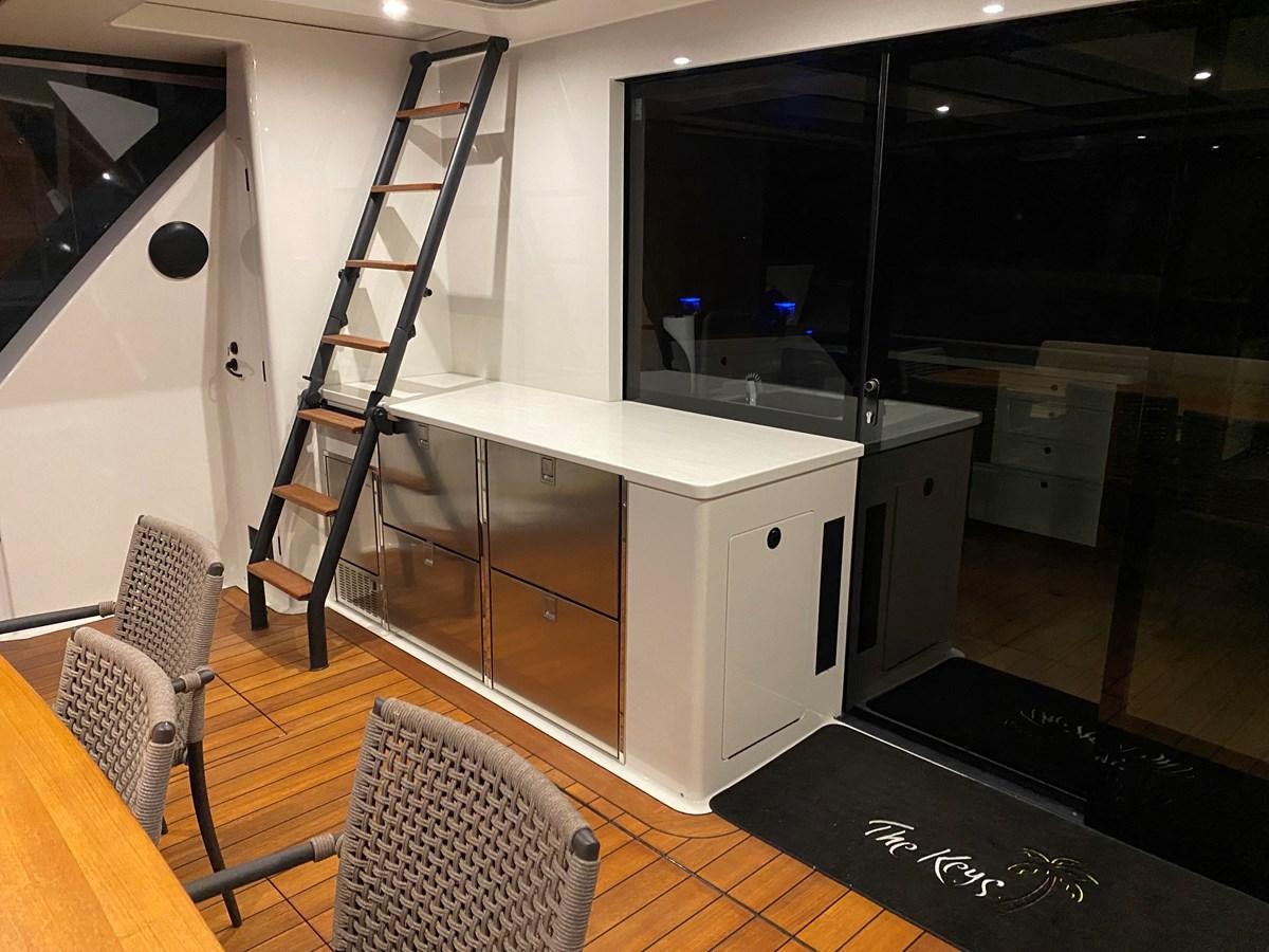 a kitchen with a ladder aboard THE KEYS Yacht for Sale
