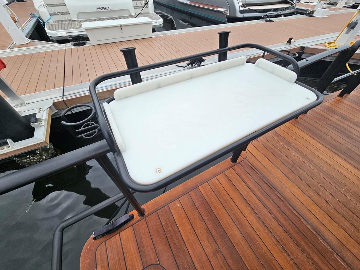 a white rectangular object on a wooden surface aboard THE KEYS Yacht for Sale