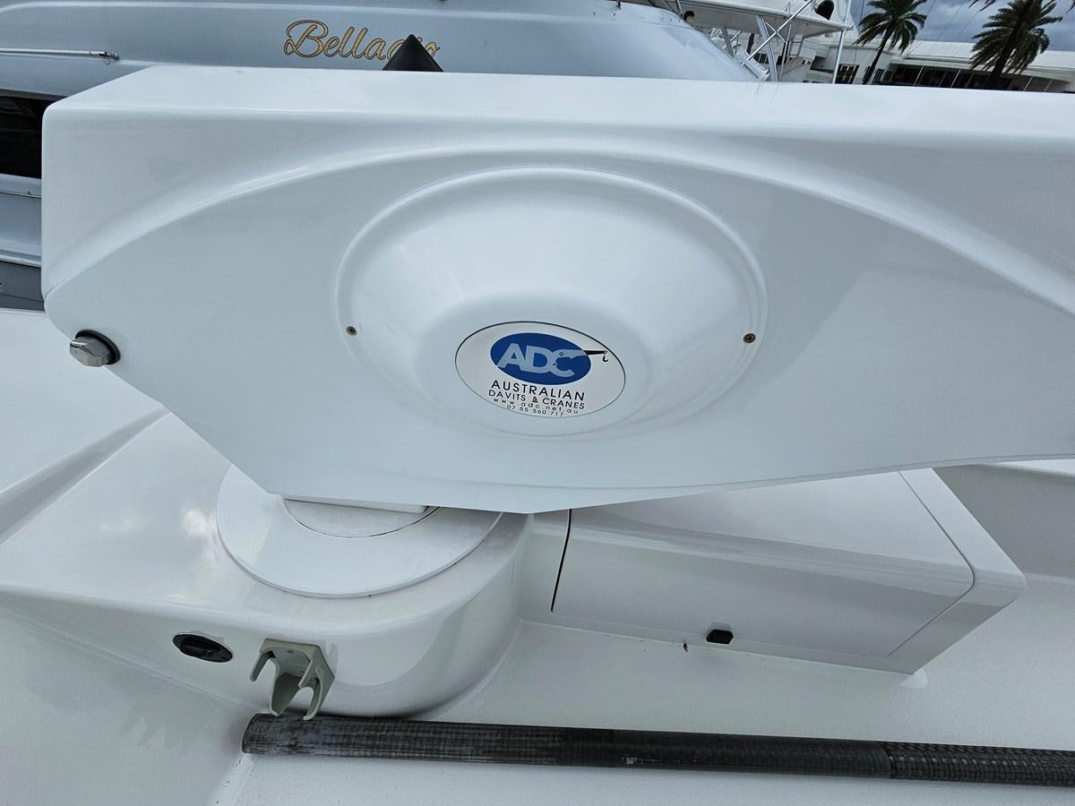 a white toilet with a blue label aboard THE KEYS Yacht for Sale