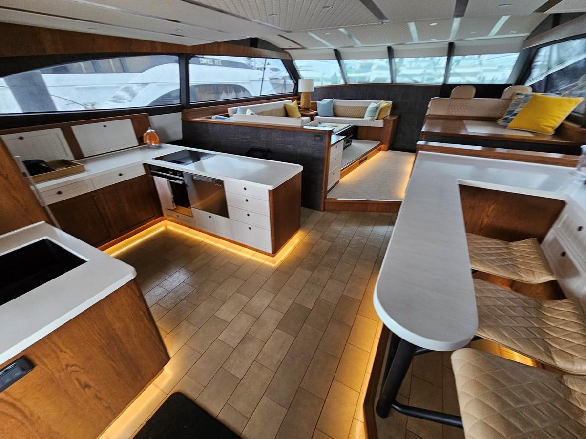 a room with a table and chairs aboard THE KEYS Yacht for Sale