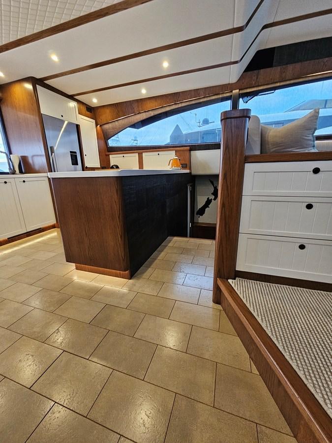 a large bathroom with a wood ceiling aboard THE KEYS Yacht for Sale