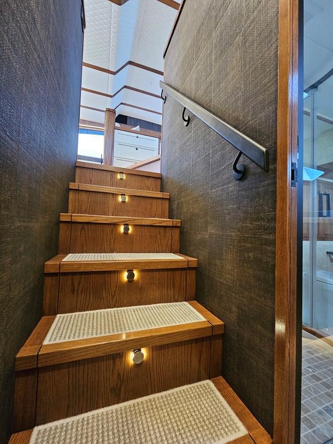 a wooden dresser in a room aboard THE KEYS Yacht for Sale