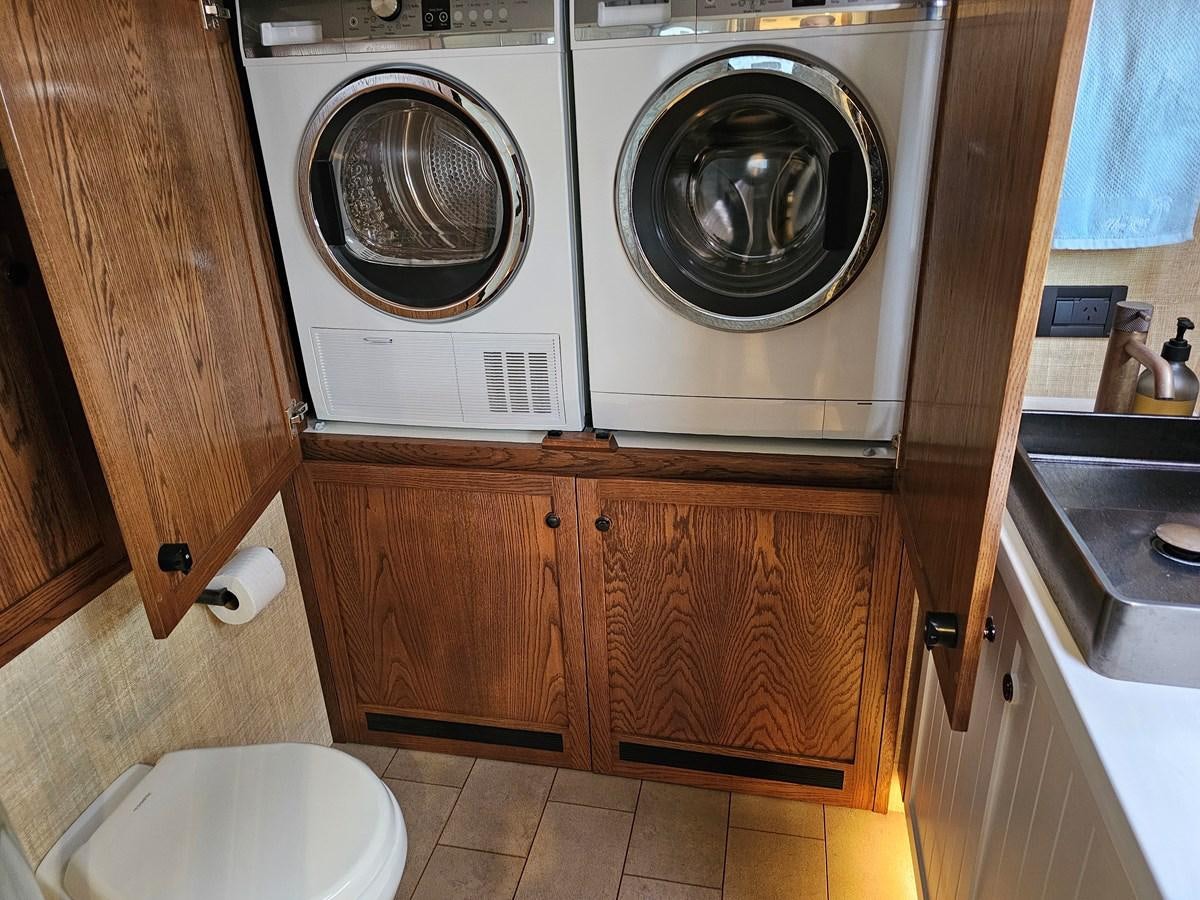 a washing machine in a kitchen aboard THE KEYS Yacht for Sale