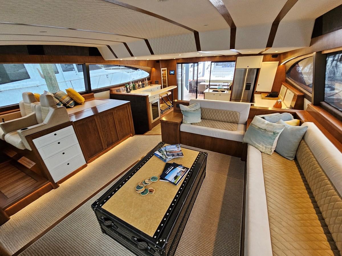 a room with a table and couches aboard THE KEYS Yacht for Sale