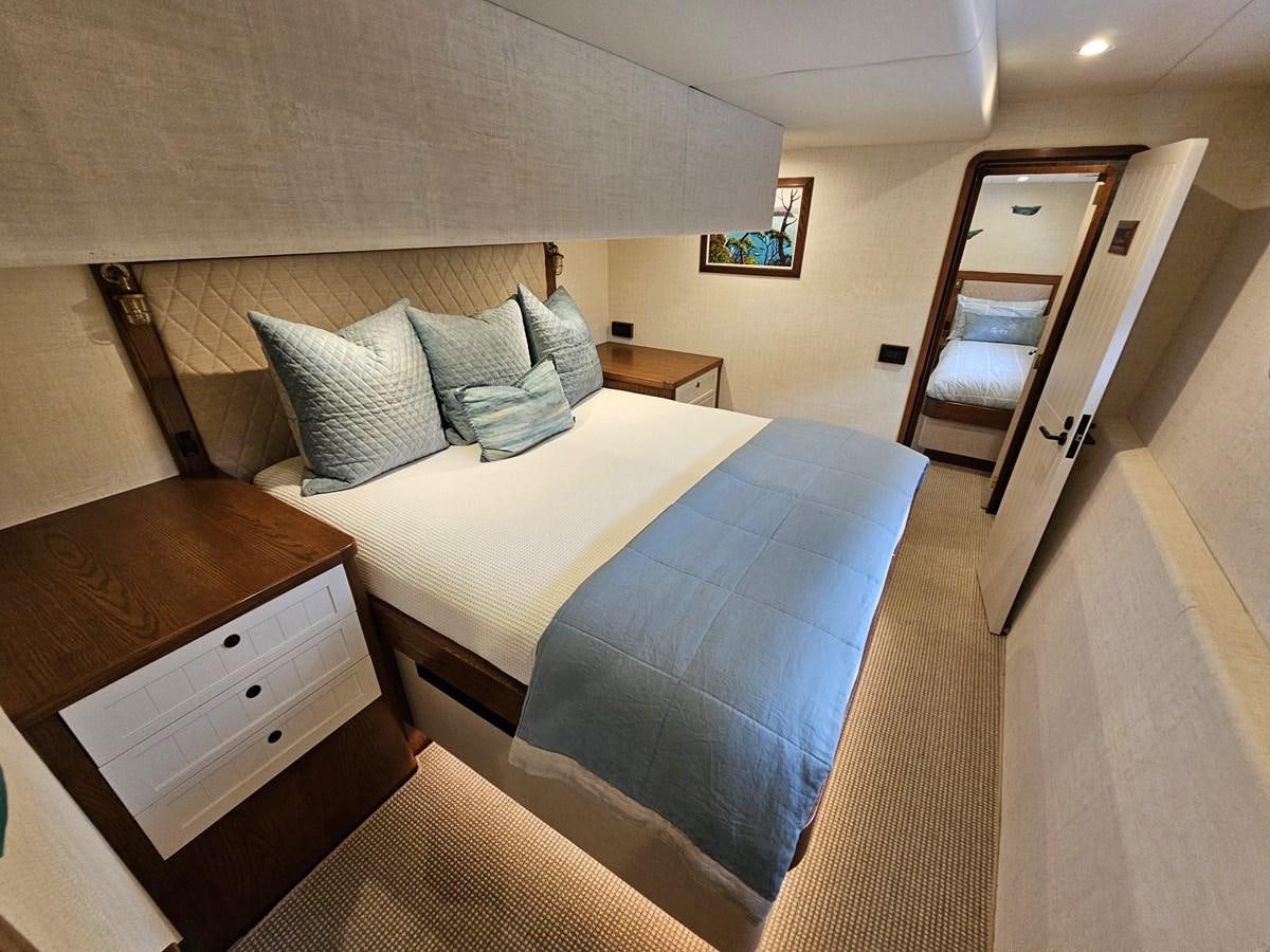 a hotel room with two beds aboard THE KEYS Yacht for Sale