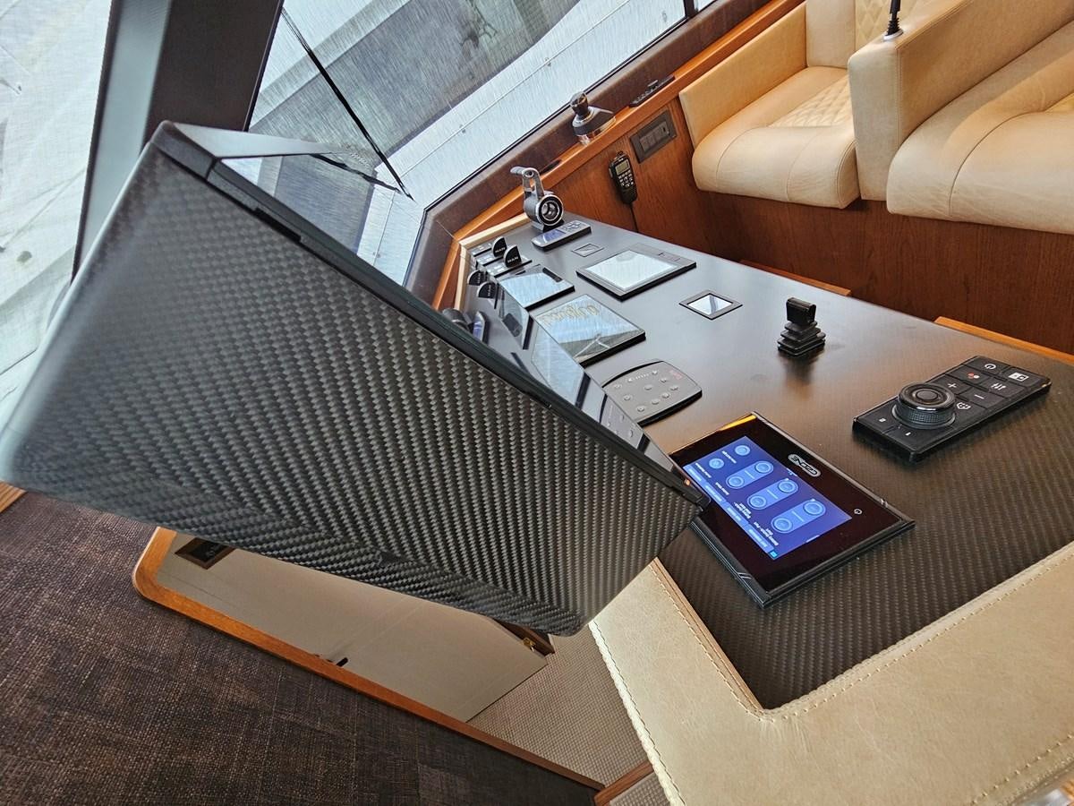 a laptop on a table aboard THE KEYS Yacht for Sale