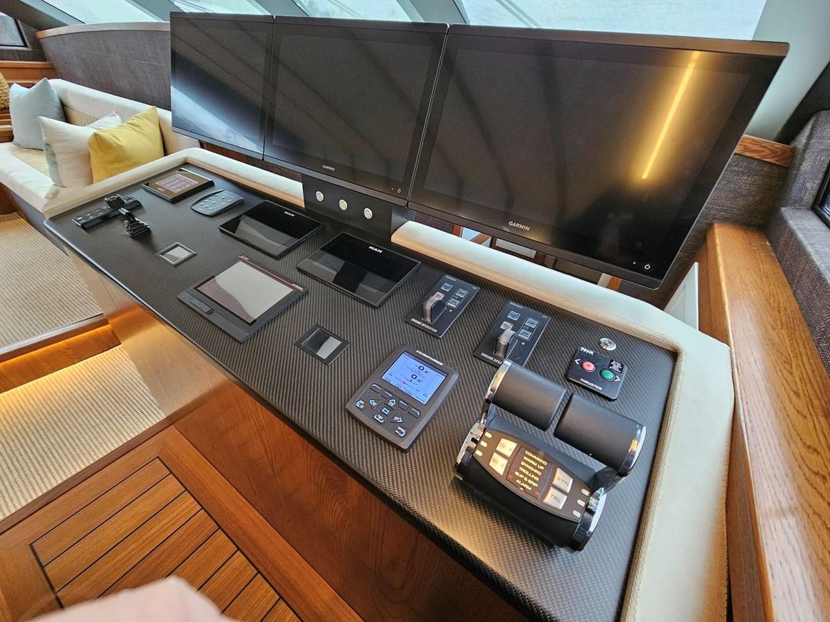 a table with cell phones on it aboard THE KEYS Yacht for Sale