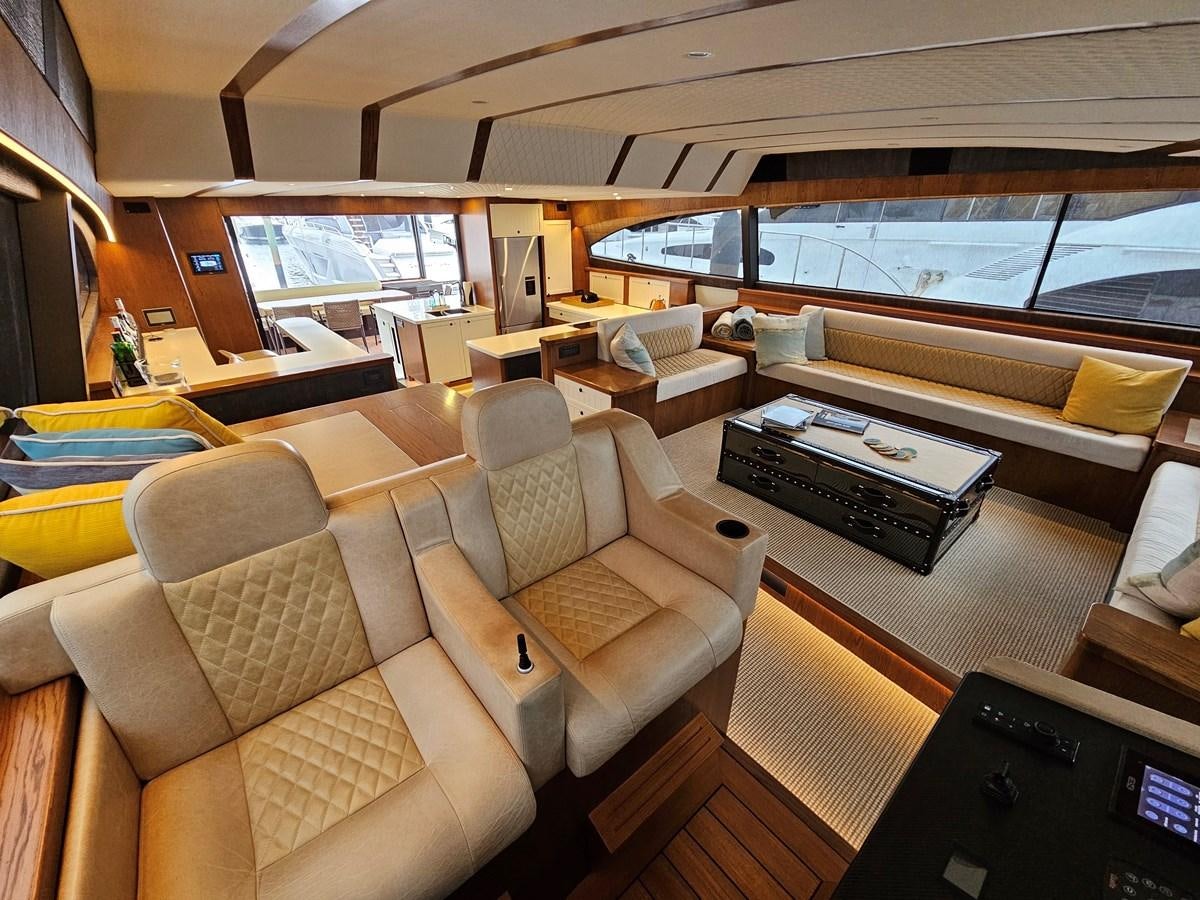 a room with couches and a television aboard THE KEYS Yacht for Sale