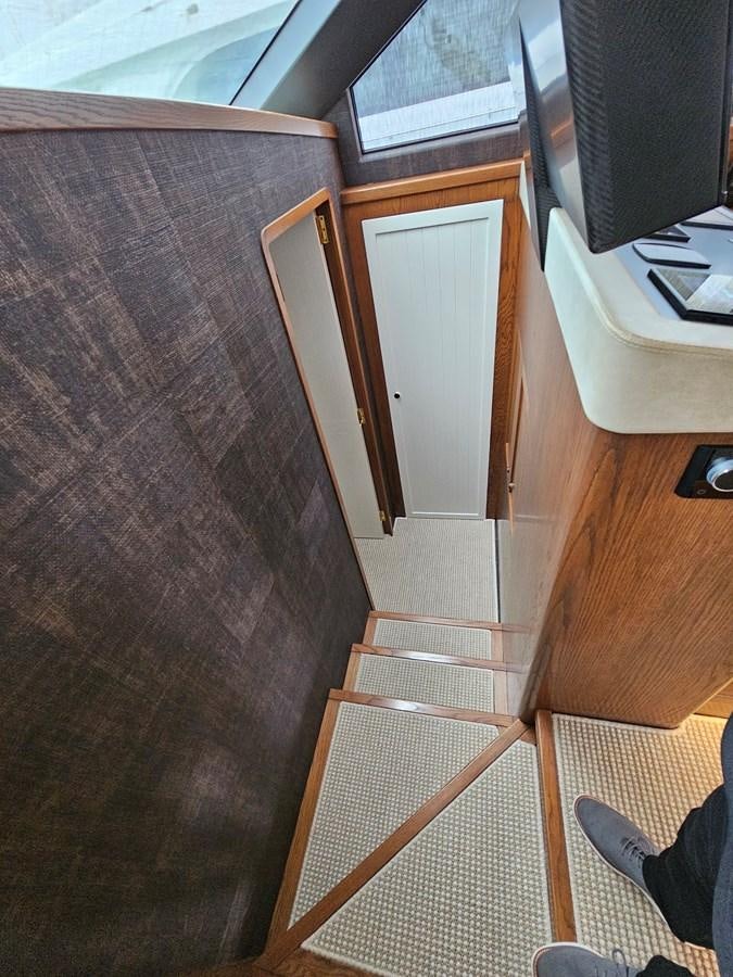 a wooden wall with a window aboard THE KEYS Yacht for Sale