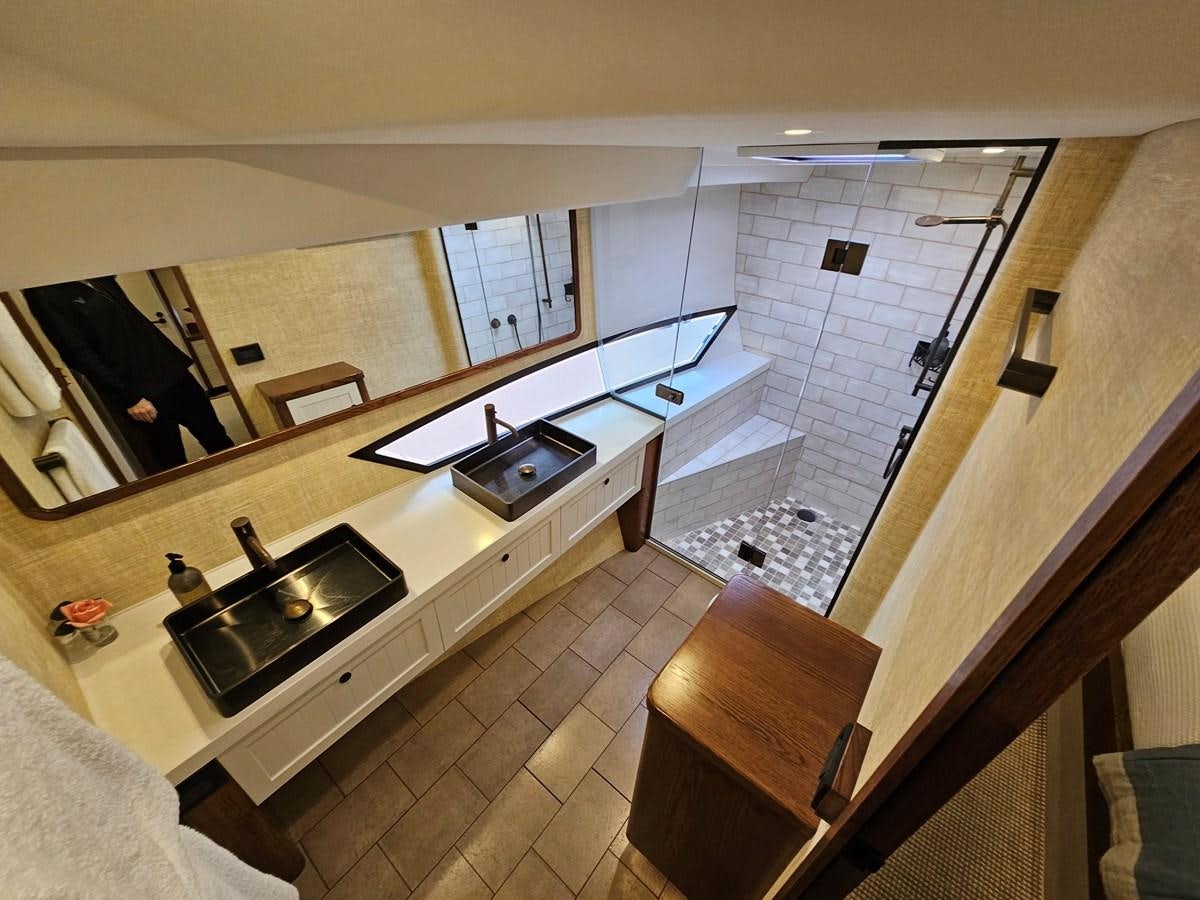 a bathroom with a large mirror aboard THE KEYS Yacht for Sale
