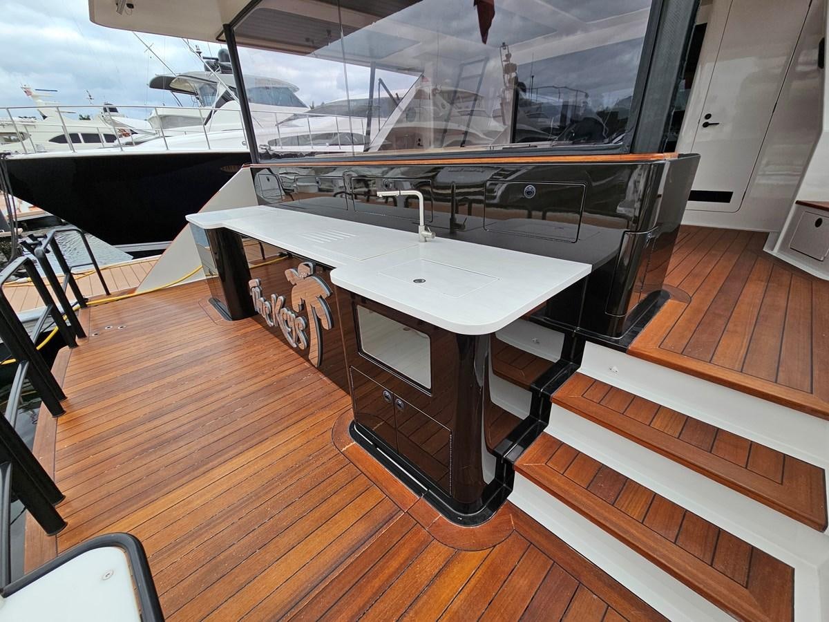 a table with a large glass window aboard THE KEYS Yacht for Sale