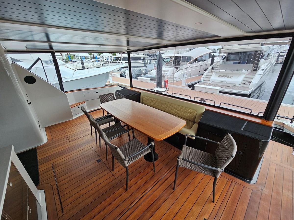 a room with a table and chairs aboard THE KEYS Yacht for Sale