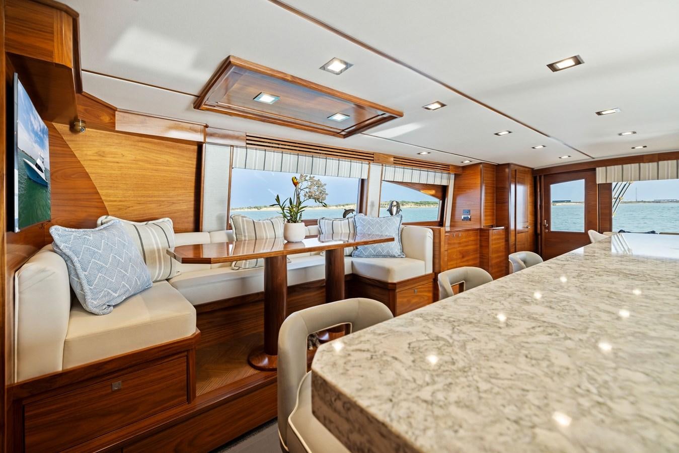 a room with a table and chairs aboard ZATARA Yacht for Sale