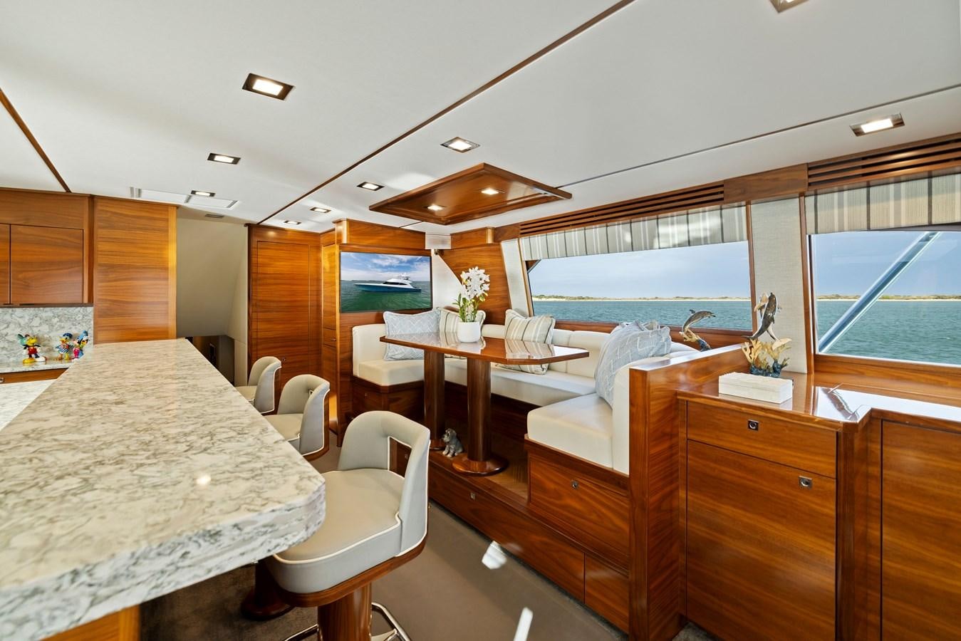 a room with a table and chairs aboard ZATARA Yacht for Sale