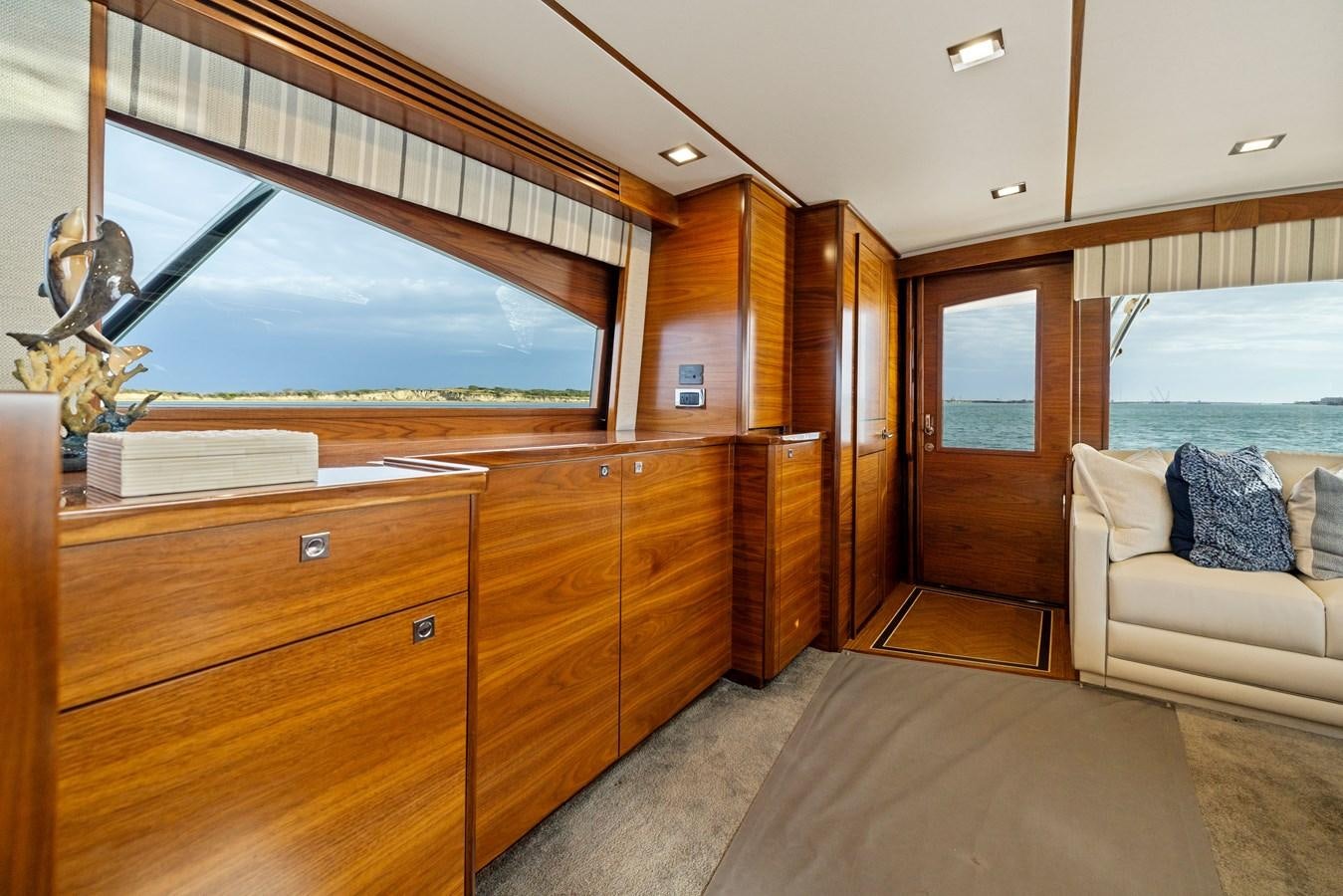 a room with a bed and a large window aboard ZATARA Yacht for Sale