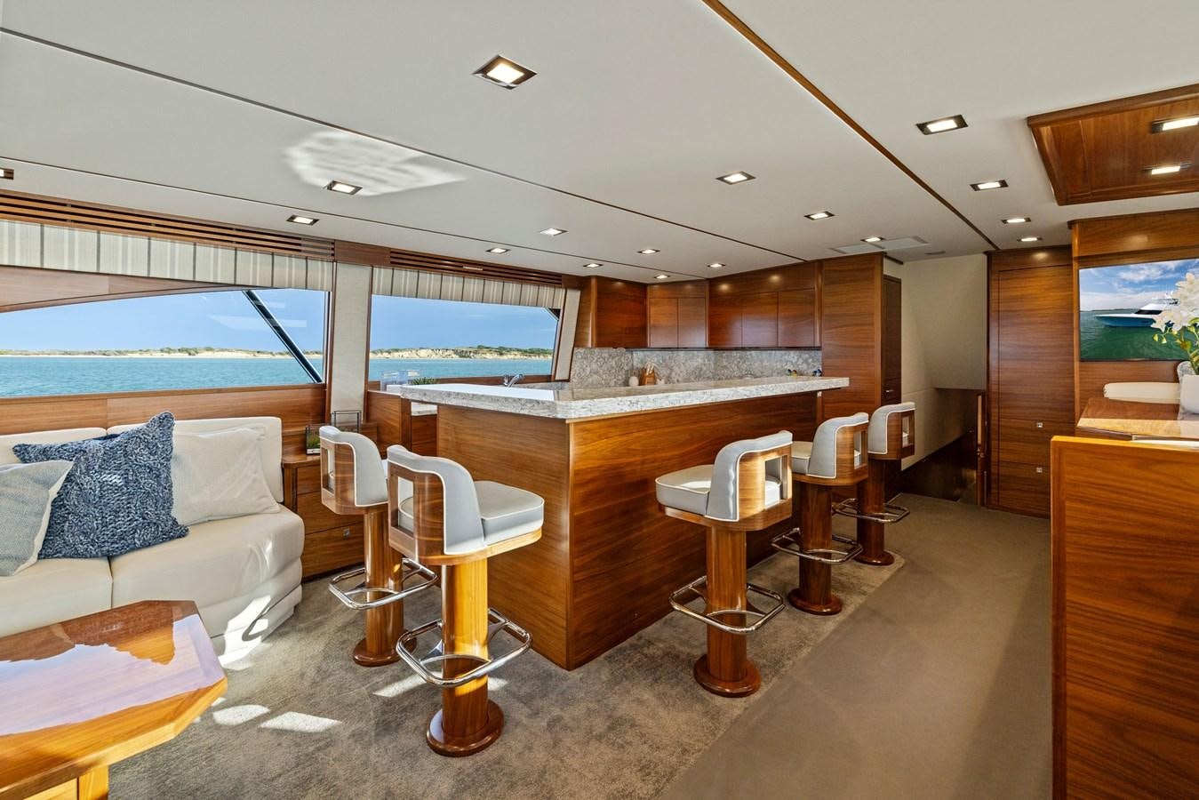a room with a couch and a table and a window aboard ZATARA Yacht for Sale