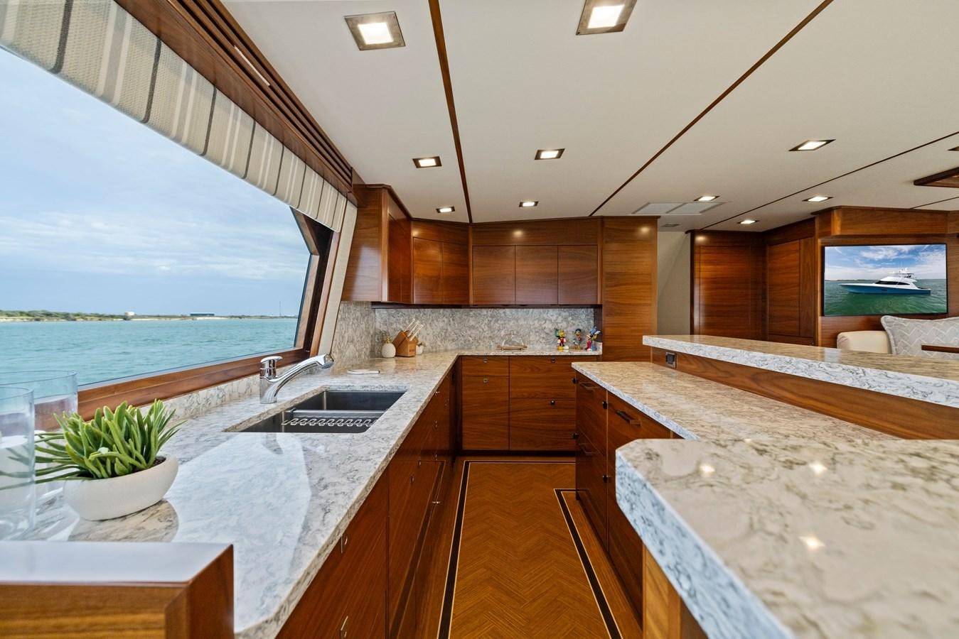 a large kitchen with a large island aboard ZATARA Yacht for Sale