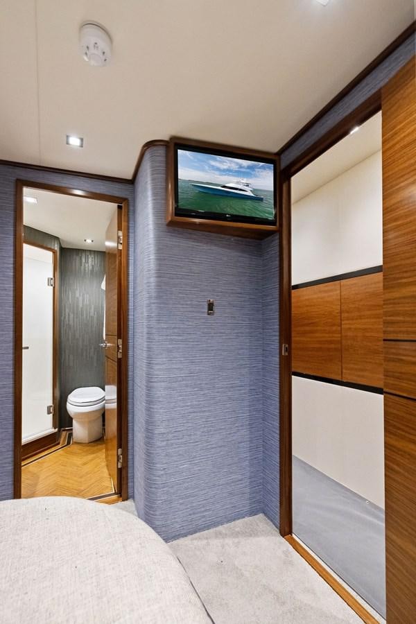 a bathroom with a tv on the wall aboard ZATARA Yacht for Sale