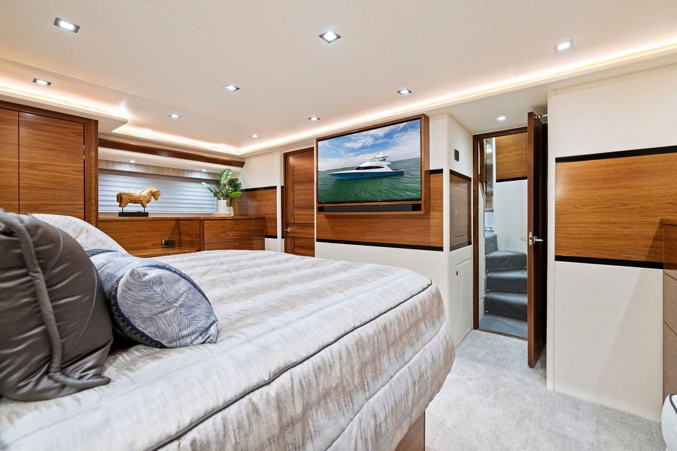 a bedroom with a bed and a television aboard ZATARA Yacht for Sale