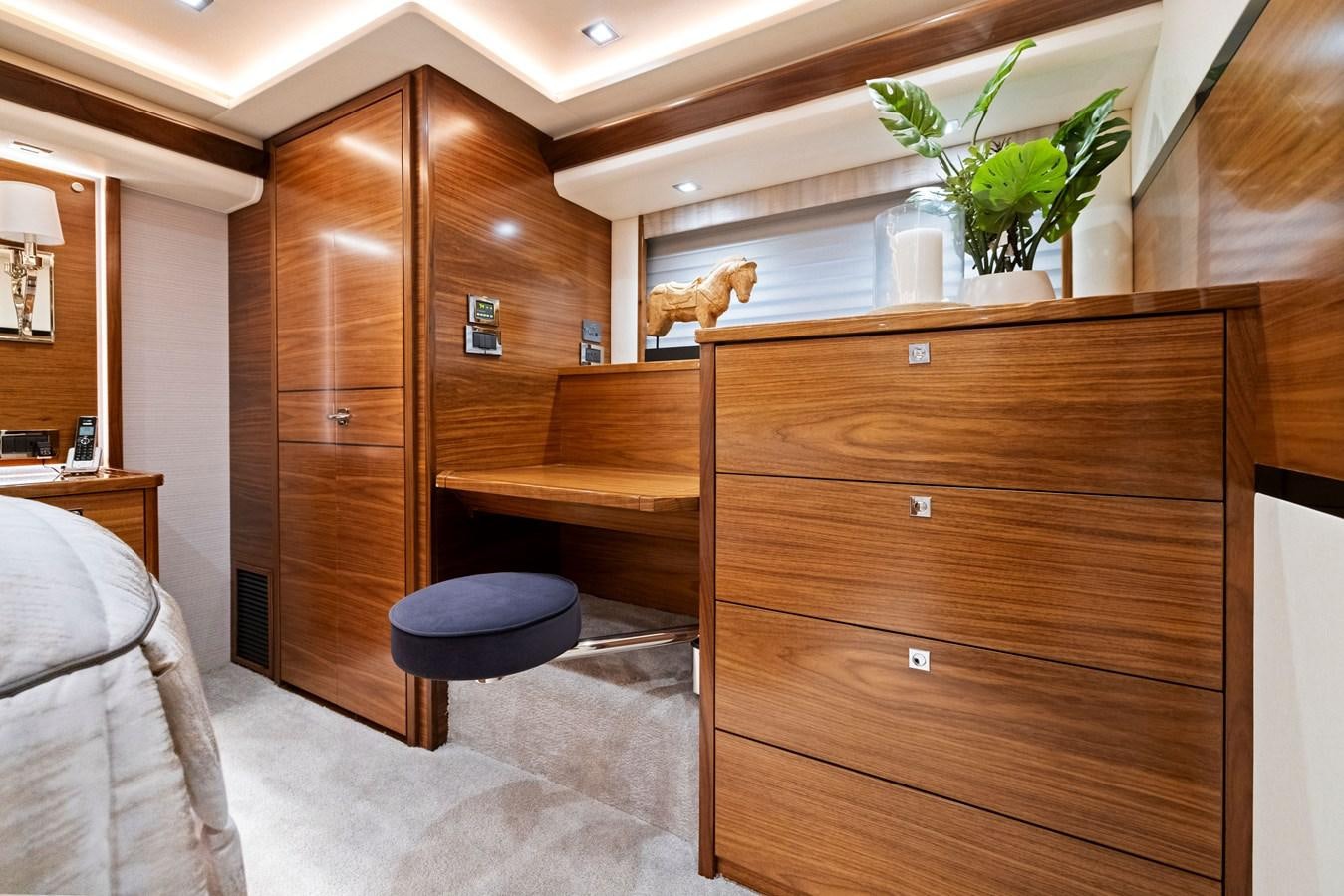 a room with a wood cabinet and a plant in it aboard ZATARA Yacht for Sale