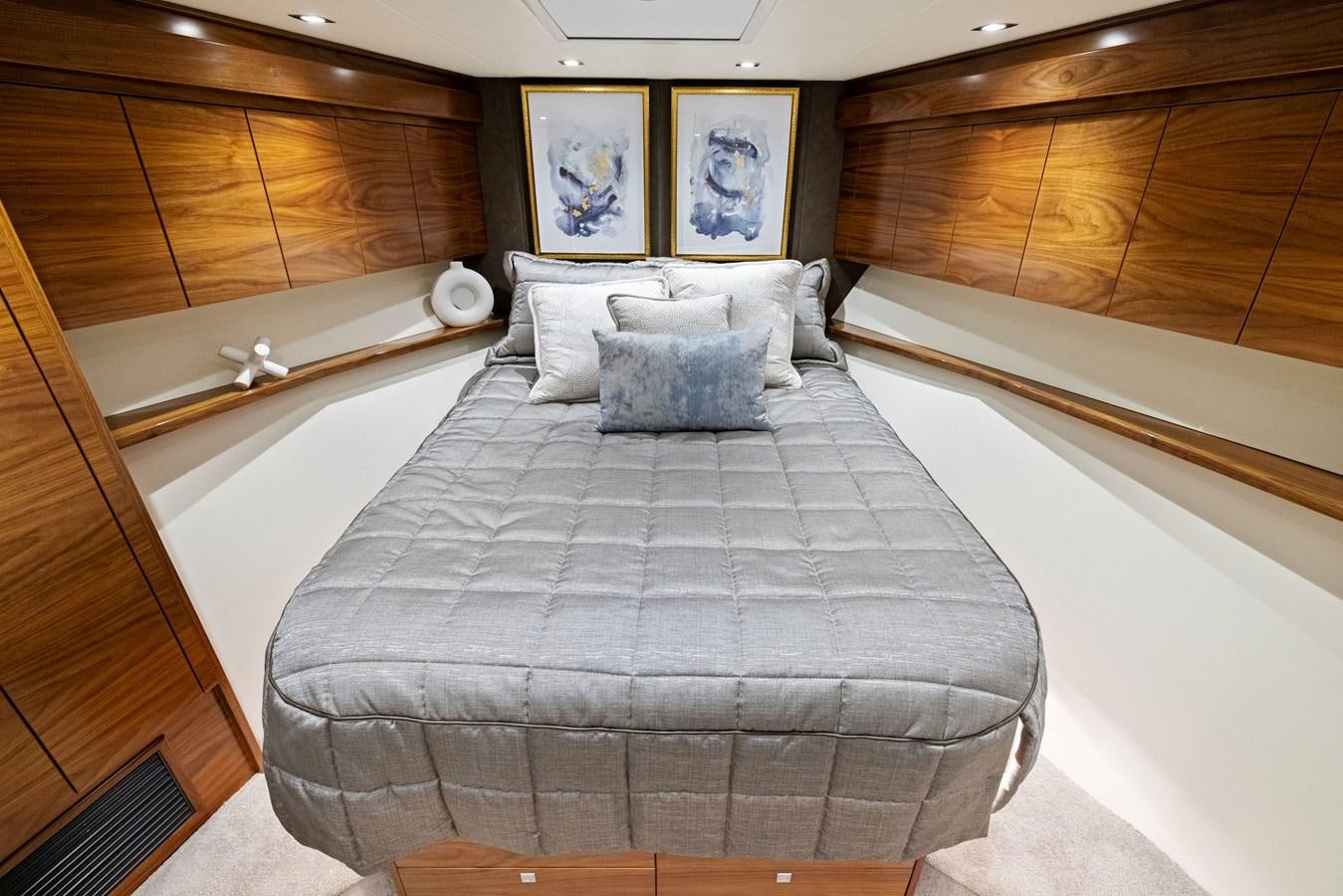 a bed with a white sheet aboard ZATARA Yacht for Sale