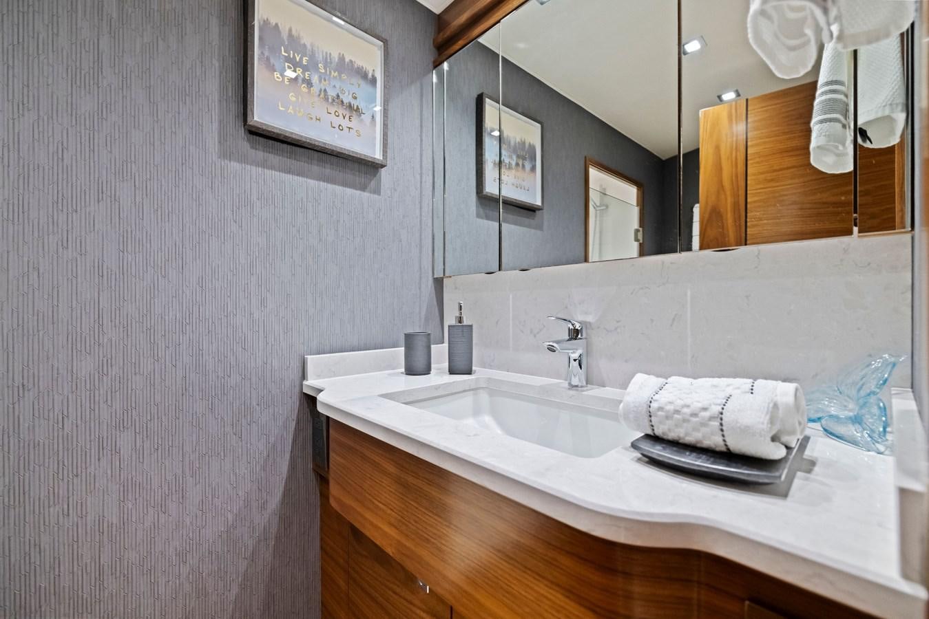 a bathroom with a sink and mirror aboard ZATARA Yacht for Sale