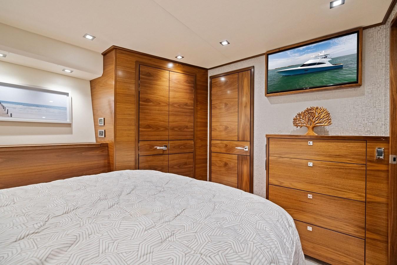 a bedroom with a wood cabinet aboard ZATARA Yacht for Sale