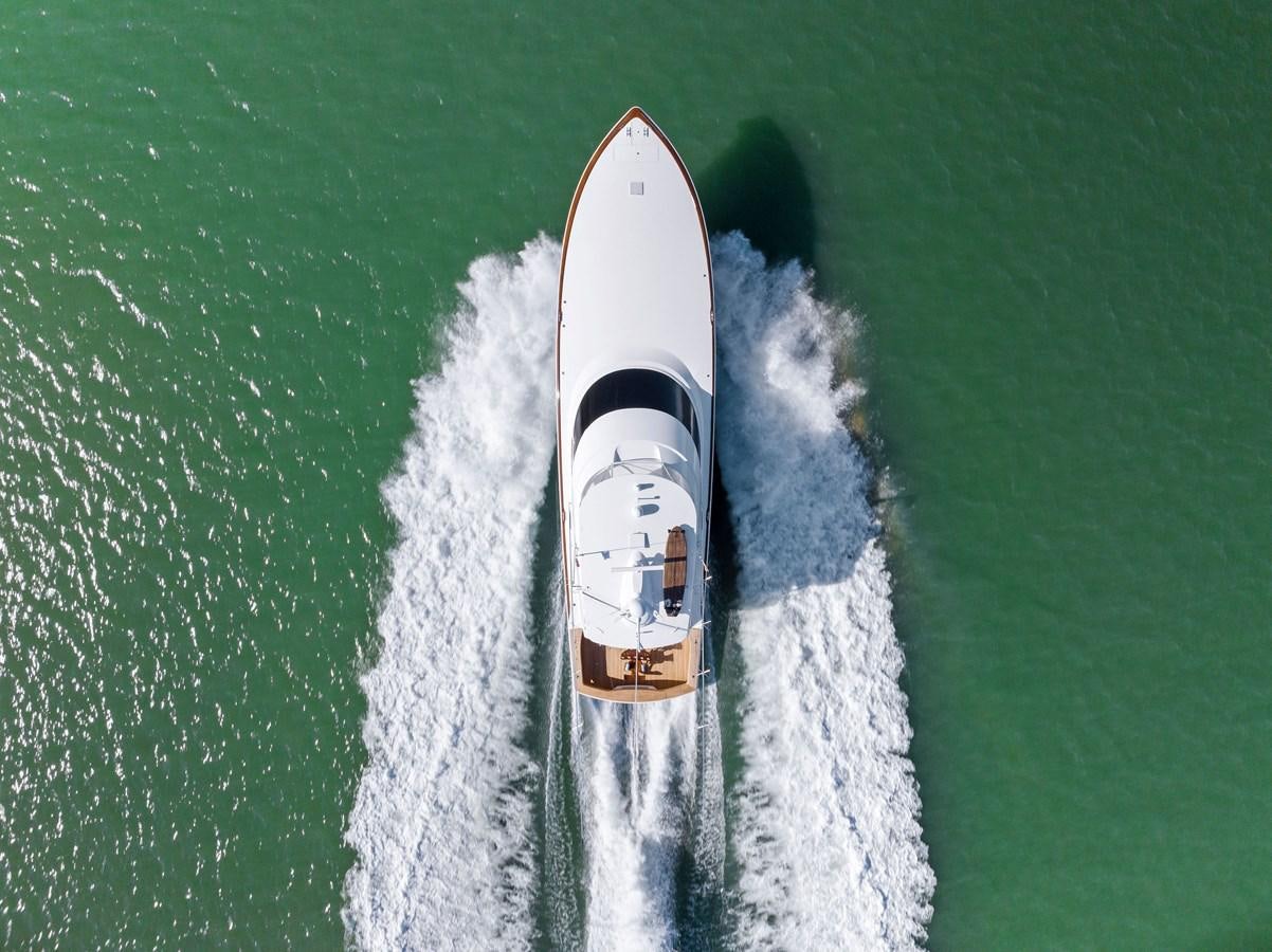 a white surfboard in the water aboard ZATARA Yacht for Sale