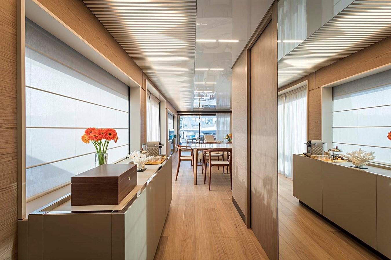 a room with a table and chairs aboard ANINHA I Yacht for Sale