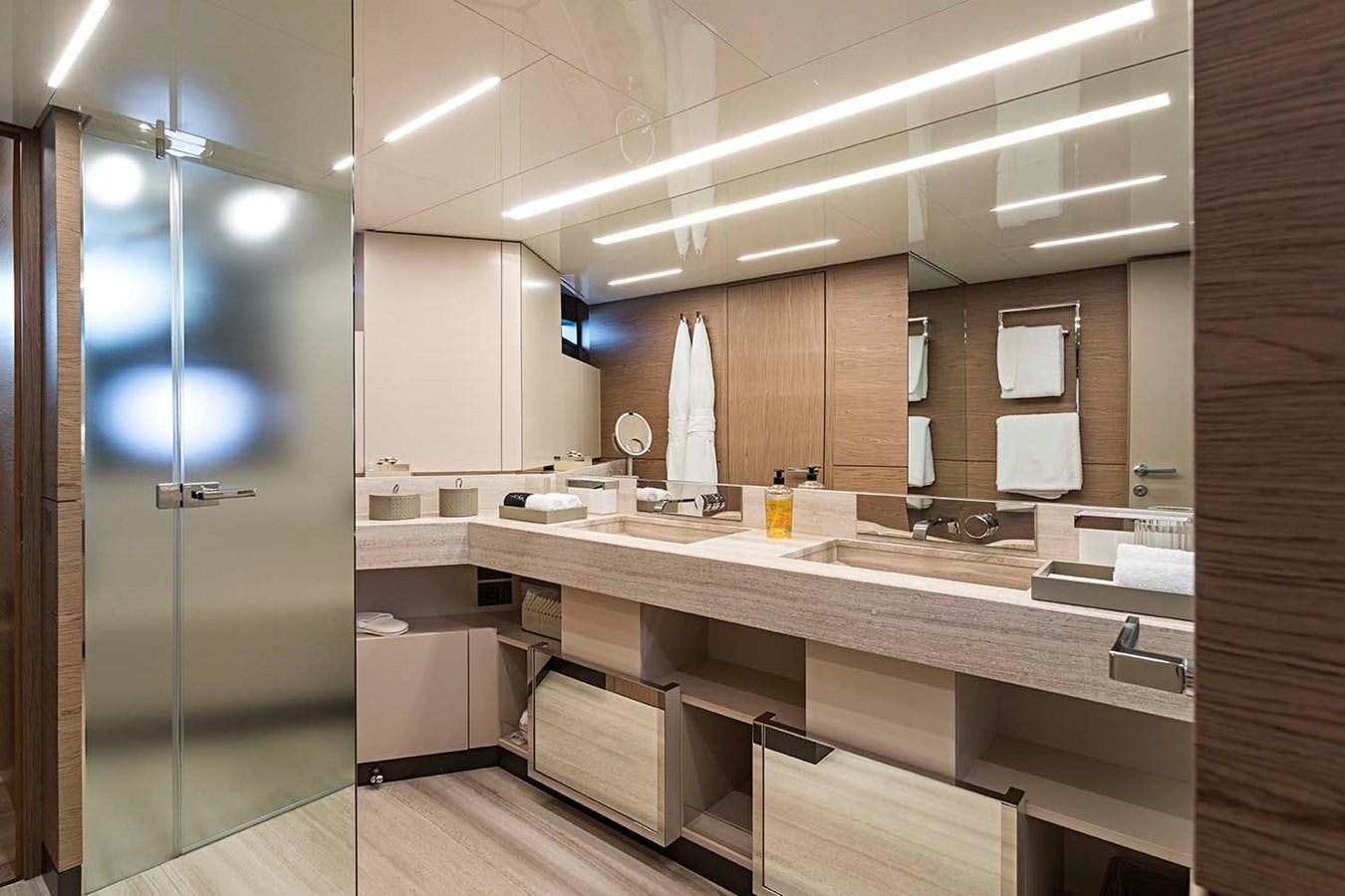 a bathroom with a glass shower aboard ANINHA I Yacht for Sale