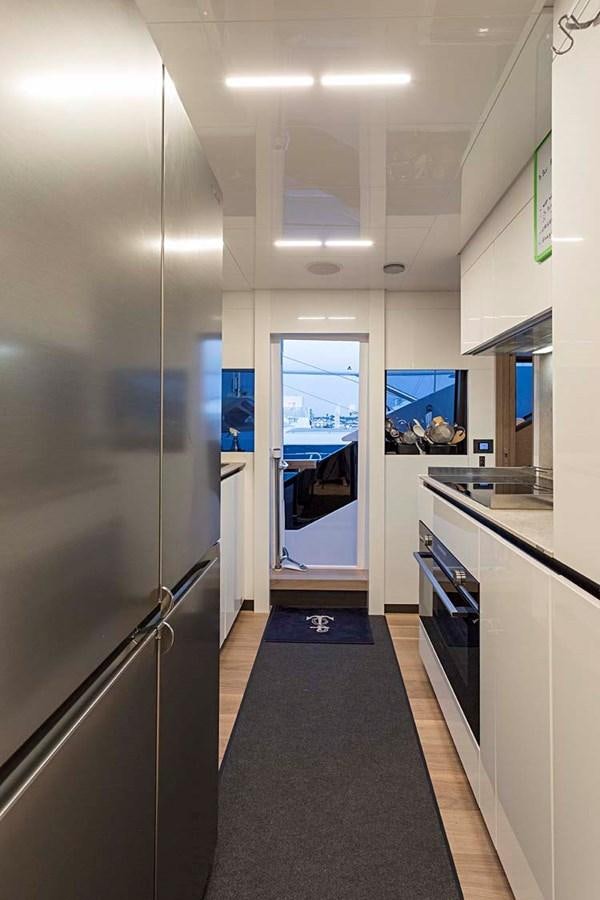 a hallway with a glass door aboard ANINHA I Yacht for Sale