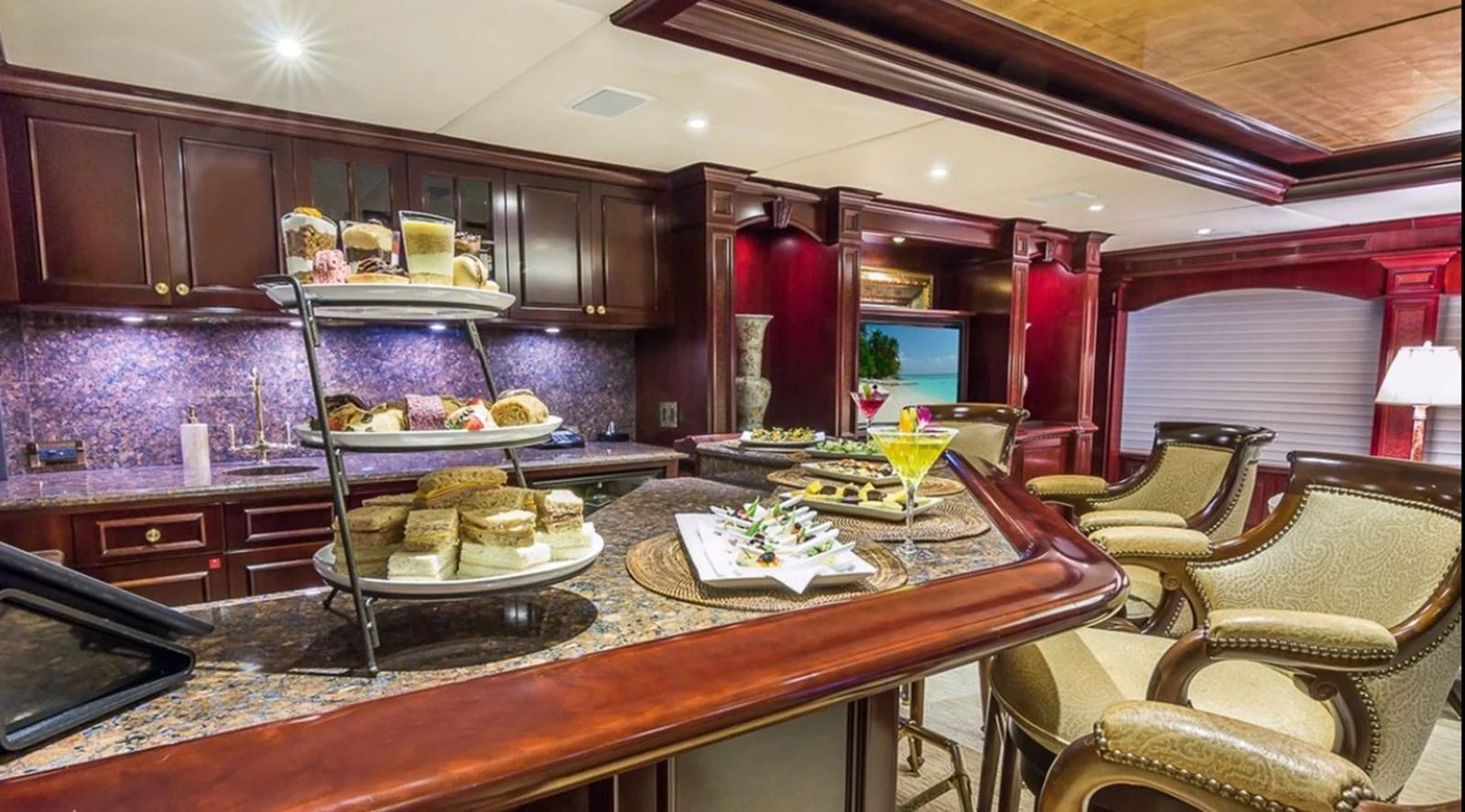 a kitchen with a table and chairs aboard TRUE LOVE Yacht for Sale