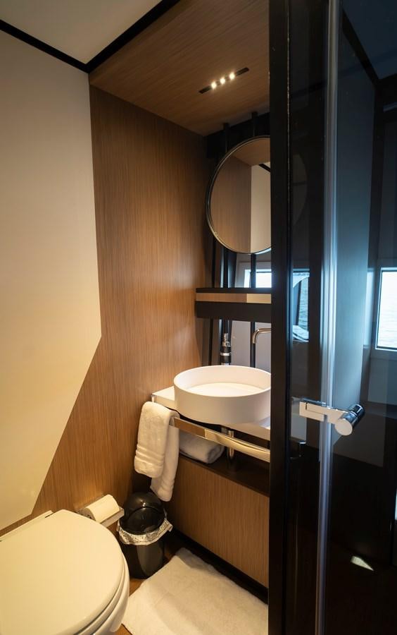 a bathroom with a sink and a mirror aboard SILVER MOON Yacht for Sale
