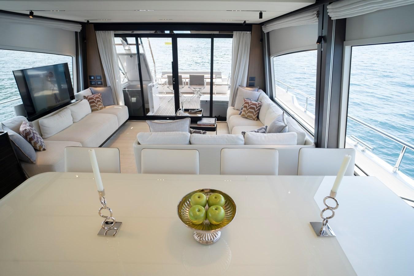 a large white table with a bowl of fruit on it aboard SILVER MOON Yacht for Sale