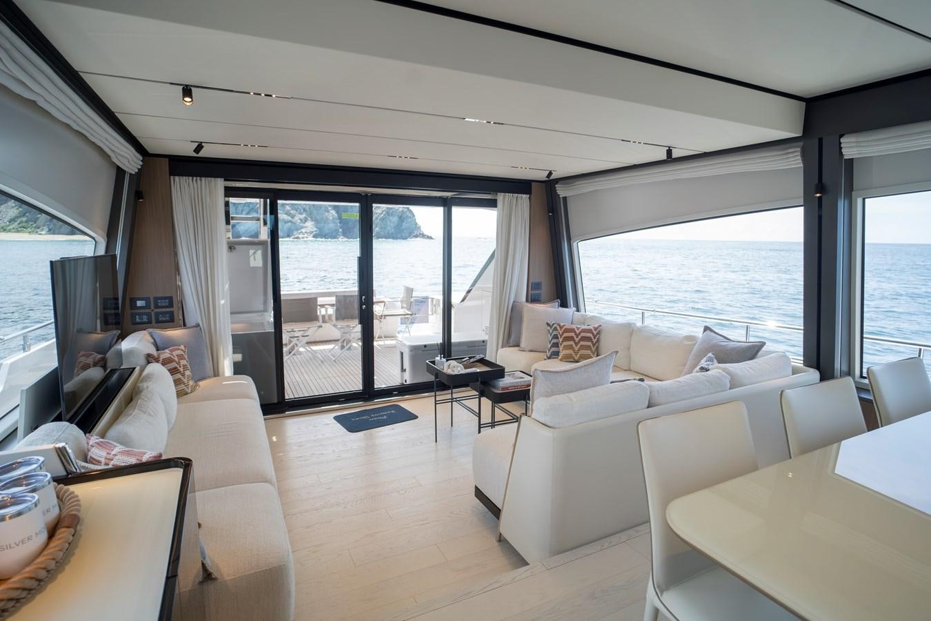 a living room with a large window aboard SILVER MOON Yacht for Sale