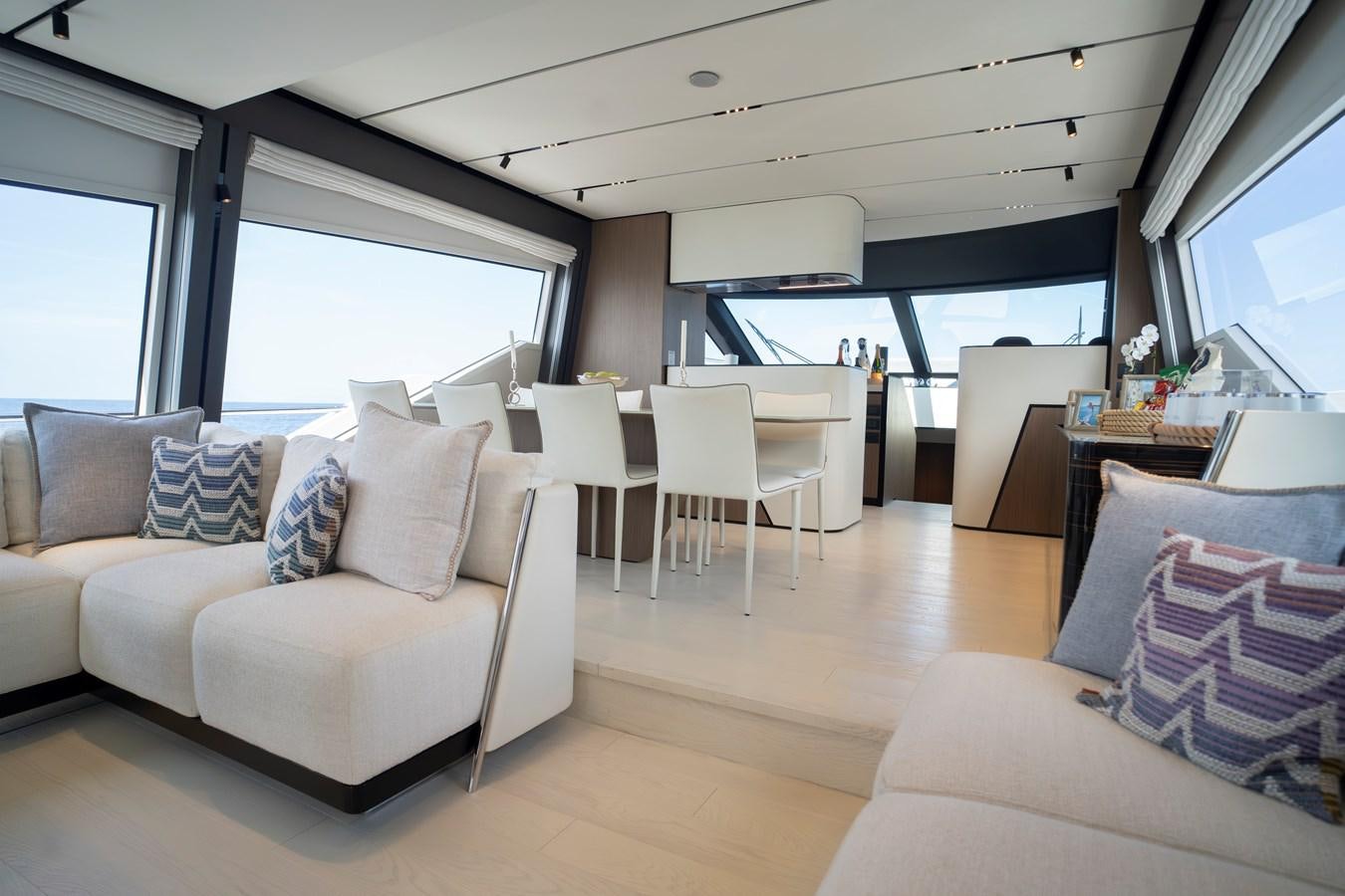 a living room with a couch and a table aboard SILVER MOON Yacht for Sale
