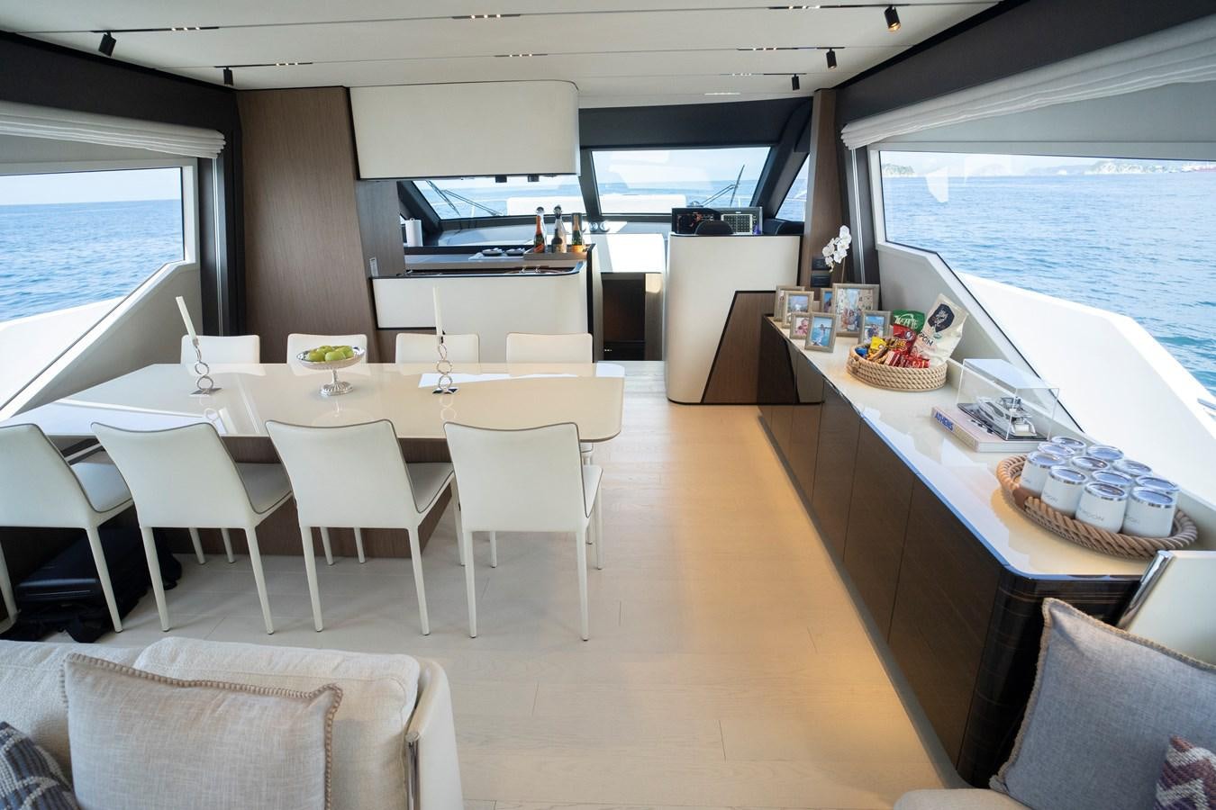 a room with tables and chairs aboard SILVER MOON Yacht for Sale