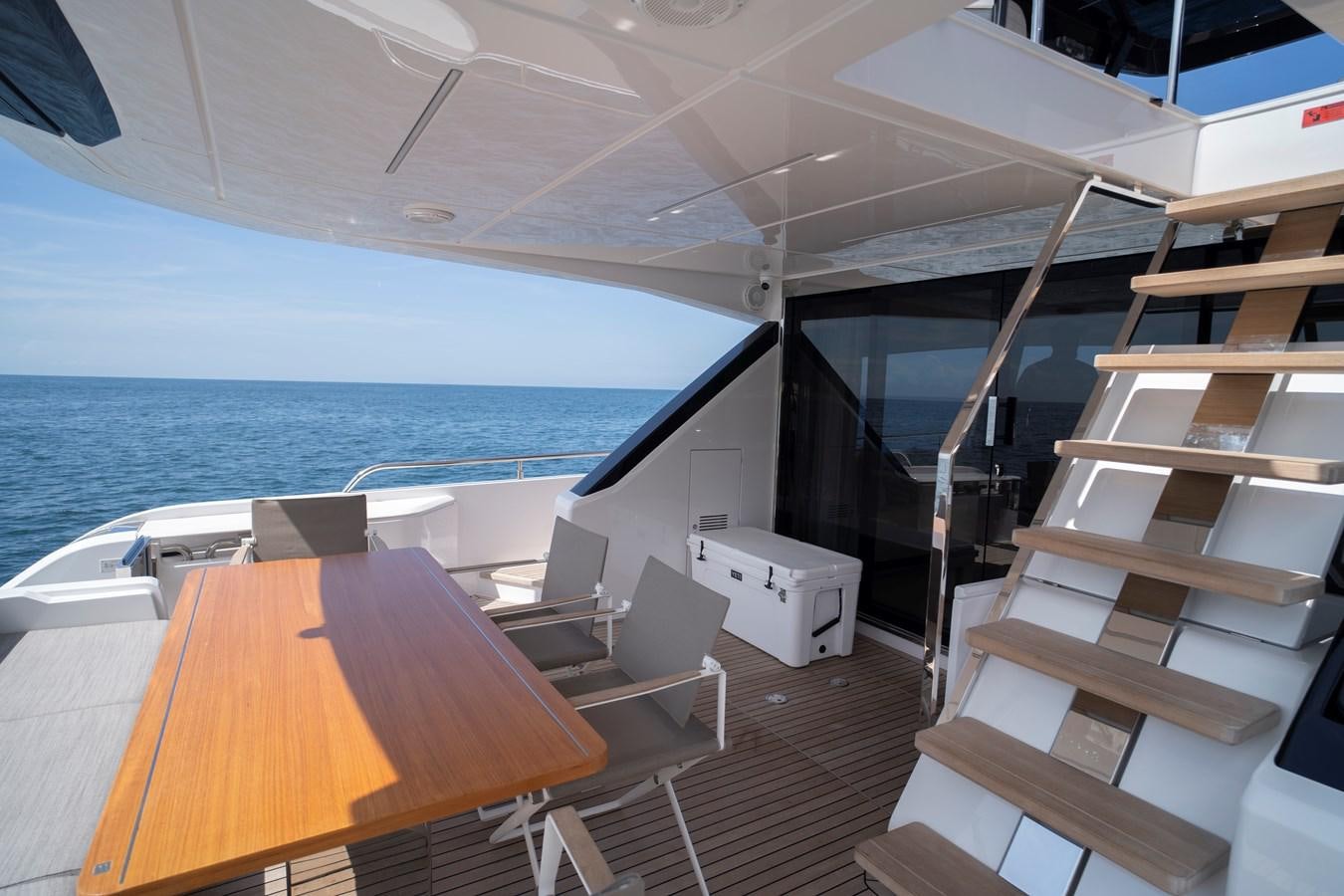 a room with a table and chairs aboard SILVER MOON Yacht for Sale