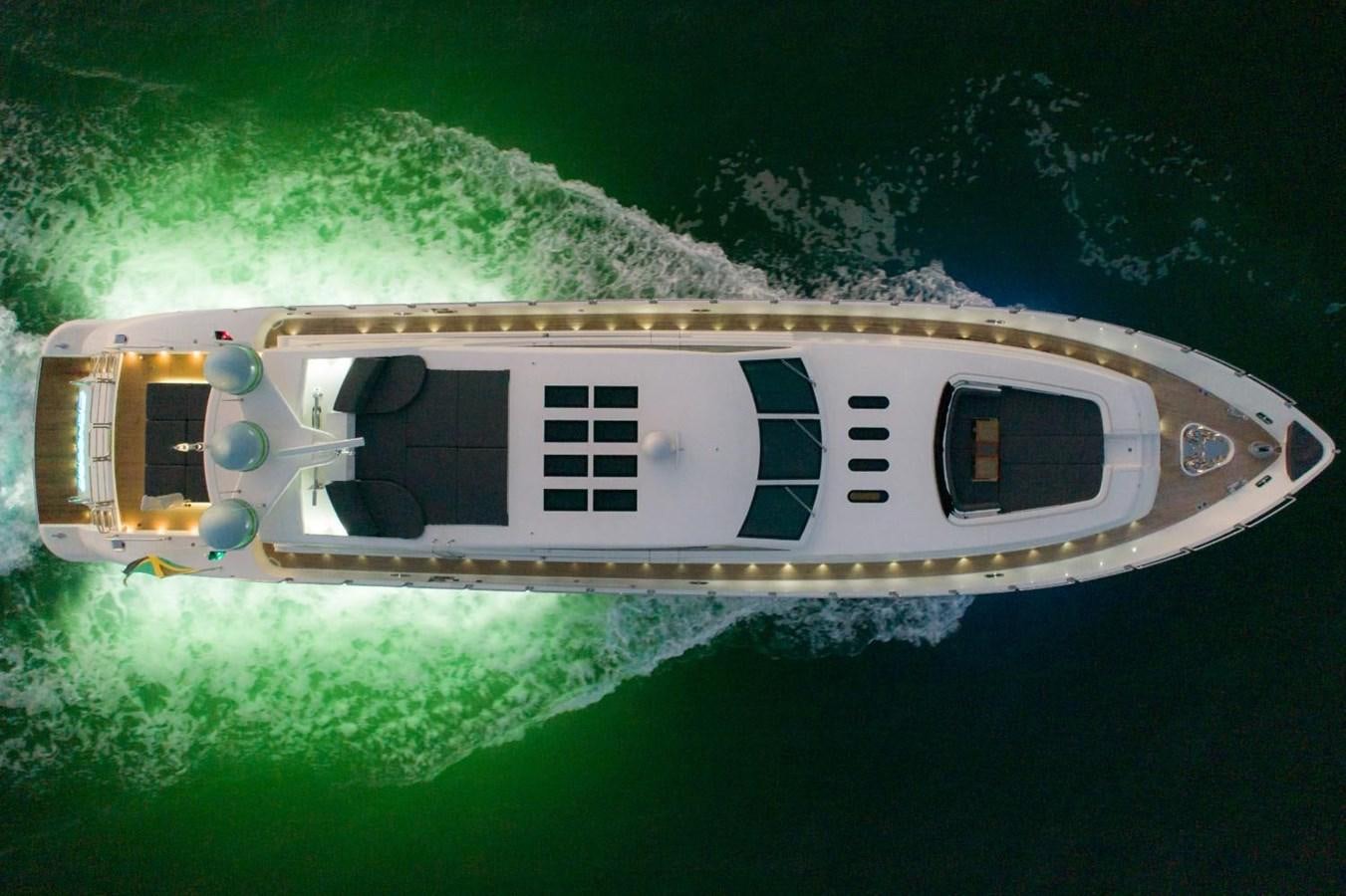 a small white helicopter in the air aboard LEOPARD Yacht for Sale